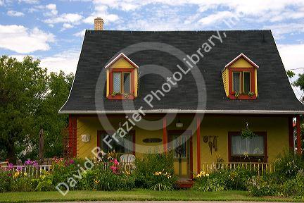 Cottage style homes in a rural area along the St. Lawrence River at L'lslet, Quebec, Canada.