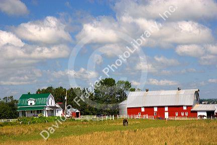 Red barn and farm house on Prince Edward Island, Canada.