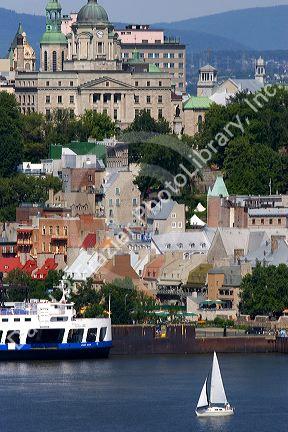 Ferry boat and sail boat on the St. Lawrence River at Quebec City, Quebec, Canada.
