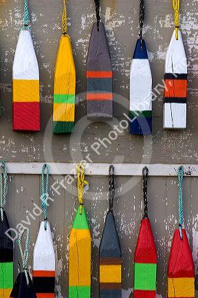 Lobster buoys hang on a wall at a village north of North Rustico on Prince Edward Island, Canada.
