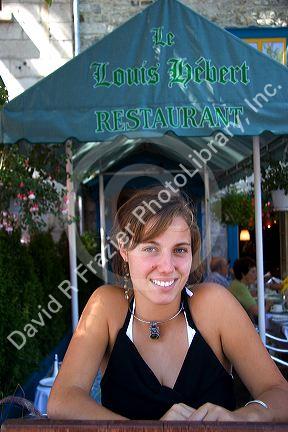 Woman hostess at an outdoor cafe in Quebec City, Quebec, Canada.