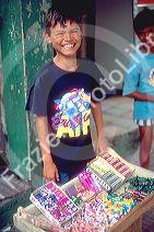 Native brazillian boy selling candy on the streets of Manaus Brazil.