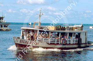 Riverboat with passengers on the Amazon River at Manaus Brazil.