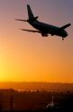 Boeing 737 landing in San Diego, California at sunset.