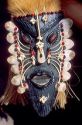 Amazon indian mask in Manaus Brazil, adorned with fish bones and scales.