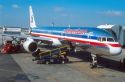 American Airline 757 being serviced by ground equiptment.