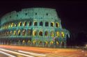 The Colosseum in Rome, Italy with light streaks from passing cars during time exposure.