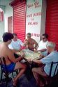 Brazillian men playing dominoes outside in Manaus Brazil.