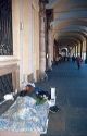 Homeless man sleeps on the street in Turin, Italy.
