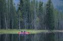 A couple kayaking on Warm Lake in the Boise National Forest, Idaho.