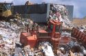Sanitary landfill with  compactors at work.