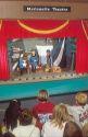 Children watch marionette puppet show.