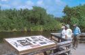 Senior citizens stand on a viewing platfom overlooking Eco Pond in the Everglades National Park, Florida.