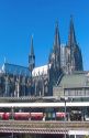 Train station at Cologn, Germany.  In German it is called the Hauptbahnhof. Cathedral towers in background.