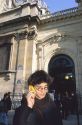 Student using a cell phone in front of the Sorbonne in Paris, France.