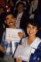 A new american citizens display certificates at a citizenship ceremony in Boise, Idaho.