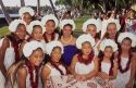 Native hawaiin girl singers and preformers dressed in traditional clothes.