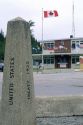 A marker that shows the international boundary of the United States of America and Canada border in East Port, Idaho and Kingston, B.C.