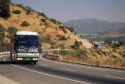 A bus traveling on the highway in rural Chile.
