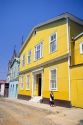 A yellow house in Valparaiso, Chile.