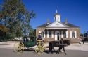 A horse drawn carriage with a view of the Court House in colonial Williamsburg, Virginia.
