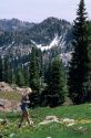 Girl hiking in an Idaho mountain meadow. MR