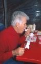 Senior citizen eating strawberry shortcake at Parkdale Farms in Plant City, Florida.