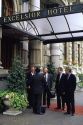 Businessmen in front of the Excelsior Hotel in Milan, Italy.