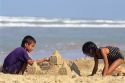 Children build a sand castle at the beach on the Texas Gulf Coast.