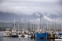 Rain clouds and foggy mist over the mountains at Santa Barbara, California with the marina in the foreground.
