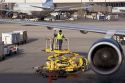 Ground crew refueling an airplane at Salt Lake City International Airport, Utah.