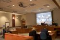 Video arraignment in criminal court in Boise, Idaho.  Defendants appear on video screen from secure jail facility while judge in courtroom conducts arraignment and sets bond.