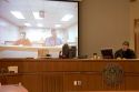 Video arraignment in criminal court in Boise, Idaho.  Defendants appear on video screen from secure jail facility while judge in courtroom conducts arraignment and sets bond.