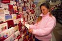 Young girl shopping for greeting cards.