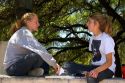 Female students talk on the campus of University of Texas in Austin.