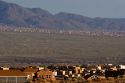 Housing development at Bernalillo, New Mexico in the area of Albuquerque.  Sandia Mountains in background.