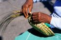 African american woman making sweet grass baskets in Charleston, South Carolina.