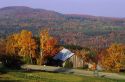 Old barn and autum leaves in Vermont.