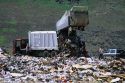 A large dump truck unloads trash at a sanitary landfill in Canyon County, Idaho.