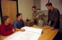 Architects meet with clients to show blue prints and building model. Boise, Idaho.