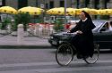 A nun riding a bicycle in Verona, Italy.