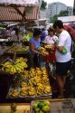 People shop at an outdoor market in Manaus, Brazil.
