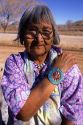 Indian pueblo woman wearing turquoise jewelry on her wrists in Taos, New Mexico.