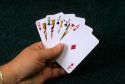 A poker hand of playing cards showing two pair.