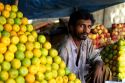 A street vendor selling fruit in India.