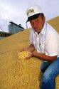 A farmer showing harvested corn in Idaho. MR