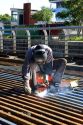 Construction worker welding on bridge deck in Buenos Aires, Argentina.