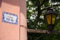 Tile street sign and lamp post in Colonia, Uraguay.