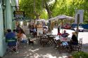 People eat at an outdoor cafe in Colonia, Uraguay.