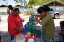 Woman making and selling shaved ice on the island of Moorea.